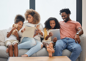 Image showing Little moments make big memories. a young family spending time together and using a digital tablet at home.