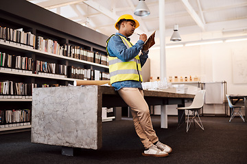 Image showing Proper planning is how you make a success of anything. an architect making notes while standing in his office.