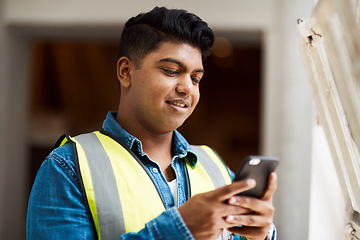 Image showing Call me for all your construction needs. a engineer using his cellphone while at work.