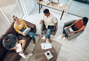 Image showing Everyone benefits from a collaborative work culture. High angle of a group of businesspeople having a discussion in an office.