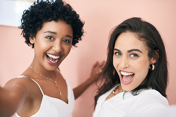 Image showing Were all for the women supporting women. two young women taking a selfie together.