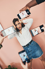 Image showing Were doing a post on the best cellphone camera. a beautiful young woman having her picture taken on multiple phones.