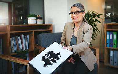 Image showing Your thoughts are yours. a mature psychologist conducting an inkblot test during a therapeutic session.