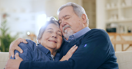 Image showing Home, hug and senior couple on a couch, love and happiness with relationship in a living room. Romance, old man and elderly woman on a sofa, support and funny with embrace, retirement and marriage