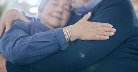 Image showing Home, hug and senior couple on a sofa, love and happiness with retirement in a living room. Romance, old man and elderly woman on a couch, support and embrace with anniversary, romantic and cheerful