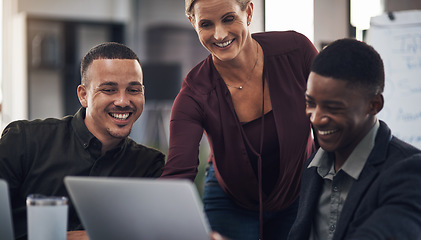 Image showing Theres great reward in seeing all your efforts come together. a group of businesspeople working together on a laptop in an office.