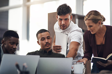 Image showing Diligent work leads to the best results. a group of businesspeople working together on a laptop in an office.