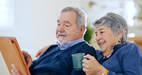 Image showing Tablet, tea and a senior couple in their home to relax together during retirement for happy bonding. Tech, smile or love with an elderly man and woman drinking coffee in their apartment living room