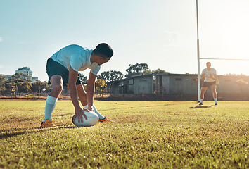 Image showing Aiming for the goalpost. a rugby player getting ready to score.