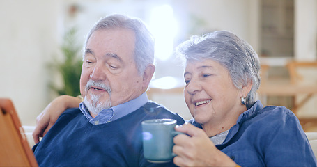 Image showing Tablet, coffee and smile with an old couple in their home to relax together during retirement for happy bonding. Tech, love or romance with a senior man and woman drinking tea in their living room