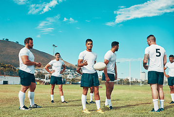 Image showing Getting ready for a brand new season. Rearview shot of a group of young rugby players standing on a field.