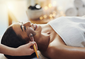 Image showing Well give you the full royal treatment. a young woman getting a facial treatment at a spa.