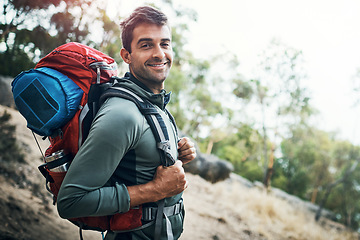 Image showing Its been an adventure indeed. Portrait of a carefree young man going for a hike up a mountain outside during the day.