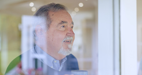 Image showing Happy, thinking or face of an old man by window in retirement with ideas or memory in living room. Remember, smile or elderly male person by glass for nostalgia in home alone drinking tea or coffee