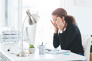 Image showing This headache is really starting to pound me down. a young businesswoman looking stressed out while working in an office.