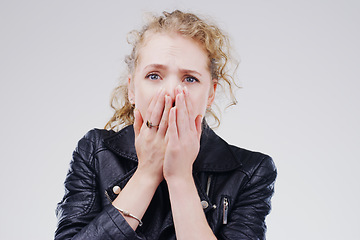 Image showing No thats terrible. Studio shot of a young woman looking shocked against a grey background.