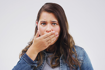 Image showing Wait...are you sure. Studio shot of a young woman looking shocked against a grey background.