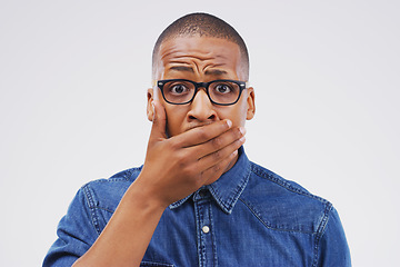 Image showing No...you must be mistaken. Studio shot of a young man looking shocked against a grey background.