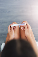 Image showing Are you ready for motherhood. an unrecognizable woman taking a pregnancy test at home.