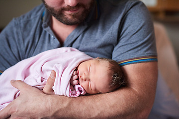 Image showing Shes captured my heart. an adorable infant girl sleeping in her fathers arms in hospital.