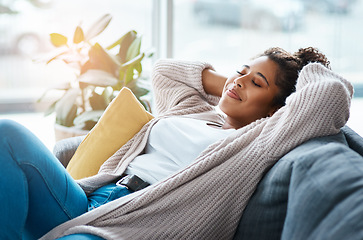 Image showing Home has never felt so comfortable. an attractive young woman relaxing on her couch at home.