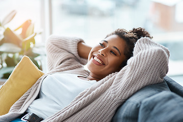 Image showing Trust me home is the perfect place to relax. Cropped portrait of an attractive young woman relaxing on her couch at home.