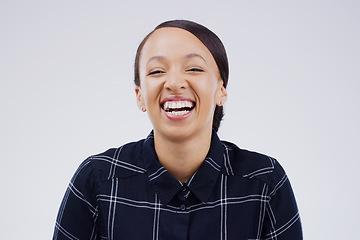 Image showing Shes got a great sense of humour. Studio portrait of an attractive young woman laughing while standing against a grey background.