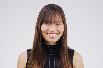 Image showing Let your smile light up the world. Studio portrait of an attractive young woman smiling against a grey background.