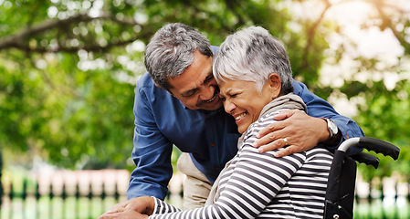 Image showing Ill be right by your side every step of the journey. a happy wheelchair bound senior woman spending the day with her husband at the park.