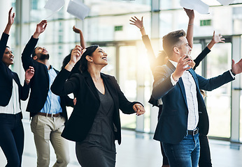 Image showing We are a fun bunch. a group of cheerful businesspeople lifting their hands in joy while being funny inside of the office at work.