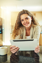 Image showing Weekends are for happy browsing. Portrait of an attractive young woman using her digital tablet at home.