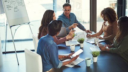 Image showing Delegating tasks to achieve success as a team. a group of businesspeople having a meeting in an office.