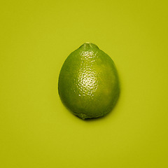 Image showing Bringing some zest to life. a lime against a studio background.