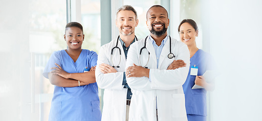 Image showing Lets start this day the way we always do. a group of medical practitioners standing together in a hospital.