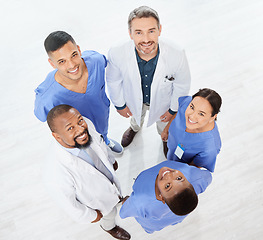 Image showing Checking the stats as a team. a group of medical practitioners standing together in a hospital.