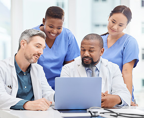 Image showing Allowing open communication leads to better results. a group of young doctors looking at a laptop during a meeting in the hospital boardroom.