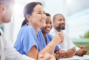 Image showing Clinical care is becoming more complex and specialised. a doctor sitting alongside his colleagues during a meeting in a hospital boardroom.