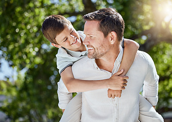 Image showing Hold on, were going home. a man spending time outdoors with his young son.