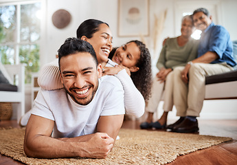 Image showing Laughter keeps the bond strong. a young family spending time together at home.