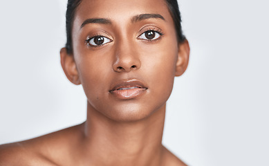 Image showing Add a little more glow and less coverage. a beautiful young woman posing against a white background.