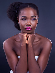 Image showing Embracing your true self radiates a beauty that cannot be ignored. Studio portrait of a beautiful young woman posing against a black background.