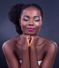 Image showing Beauty is the illumination of your soul. Studio shot of a beautiful young woman posing against a black background.