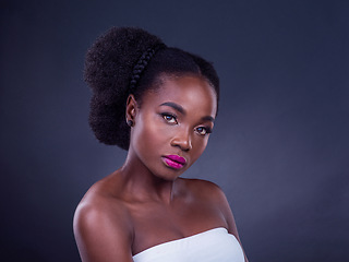 Image showing Real beauty is to be true to oneself. Studio portrait of a beautiful young woman posing against a black background.