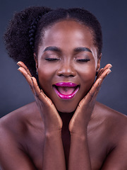 Image showing Sparkle, shine and glow girl. Studio shot of a beautiful young woman posing against a black background.