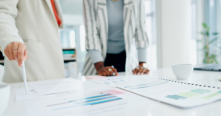 Image showing Women, hands, coffee and discussion with documents, reading or analysis for report in workplace. Partnership, coaching and paperwork at desk for proposal, compliance or research in financial agency