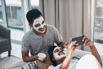 Image showing Love and facials, the best ingredients to boost your glow. a young couple taking selfies while getting homemade facials together at home.