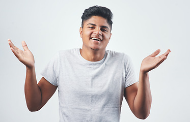 Image showing Lets laugh about it and move on. Studio shot of a young man posing against a white background.