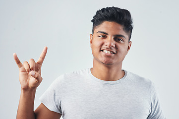 Image showing Keep the good vibes going. Studio shot of a young man posing against a white background.