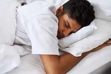 Image showing Theres nothing a good nap cant fix. a young man sleeping in his bed.