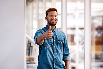 Image showing Im behind you. Cropped portrait of a handsome young male designer giving thumbs up to the camera while standing in his office.